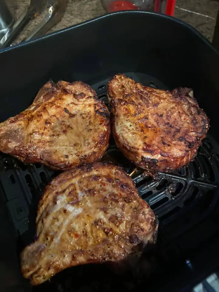 Pork chops with oil to prevent from sticking to an air fryer